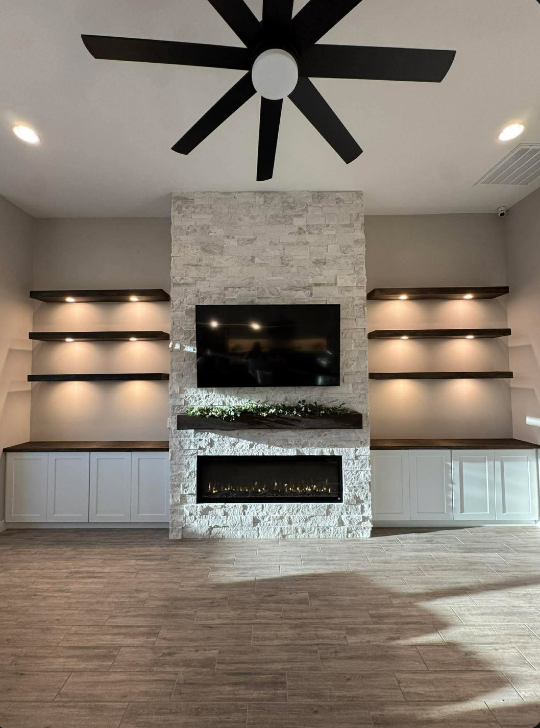 Stacked stone feature wall with linear fireplace